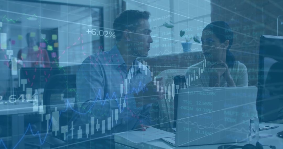 Colleagues Analyzing Financial Data in Modern Office with Digital Overlay