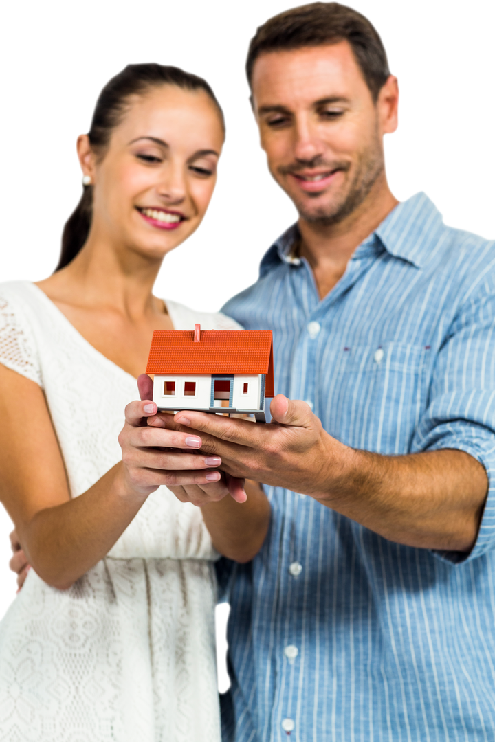 Happy Young Couple Holding House Model with Transparent Background - Download Free Stock Images Pikwizard.com