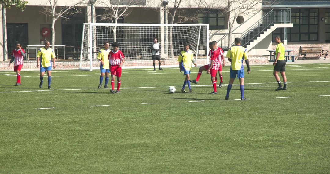 Youth Soccer Players Competing on Sunny Day
