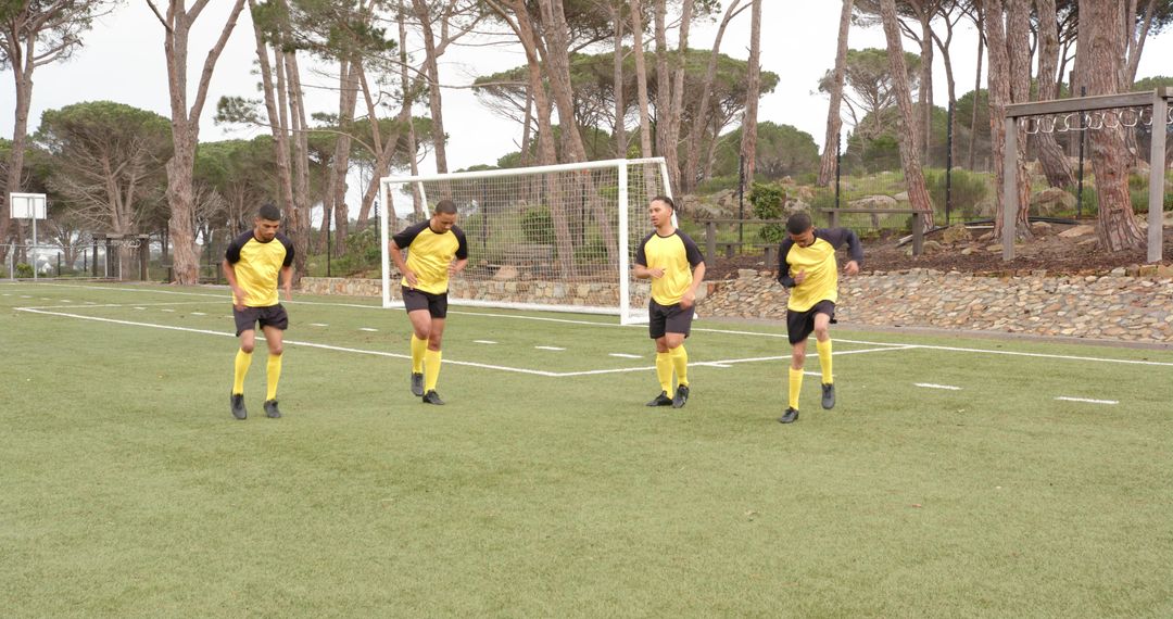 Soccer Players Stretching and Preparing on the Field