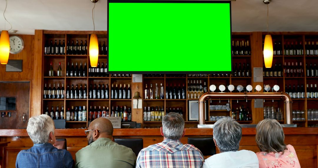 Group of Adults Watching Sports Event on Green Screen in Bar Setting