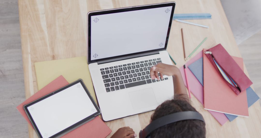 Girl Studying with Laptop and Tablet at Home Workspace