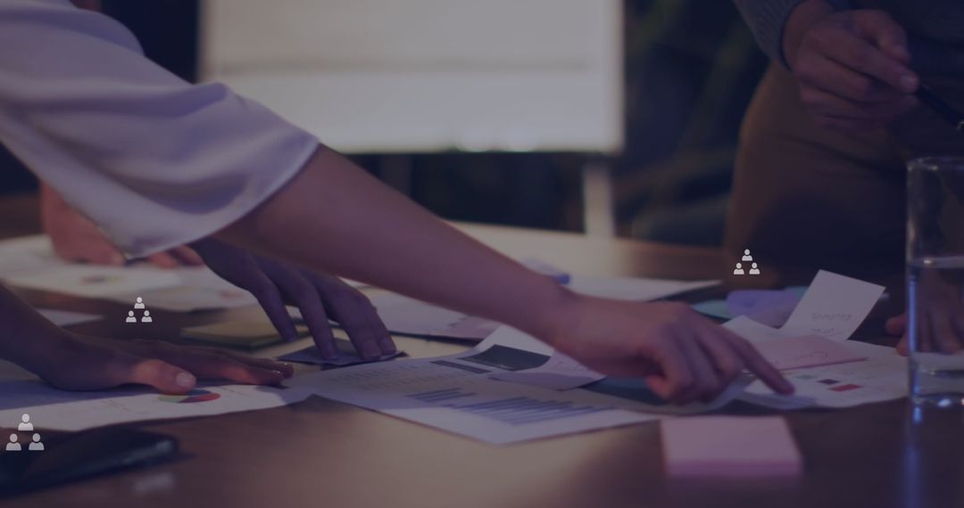 Collaborative Team Analyzing Financial Reports in Office