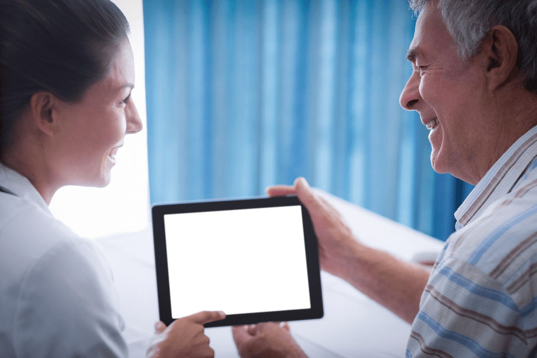 Doctor Holding Transparent Tablet with Senior Patient Smiling at Clinic