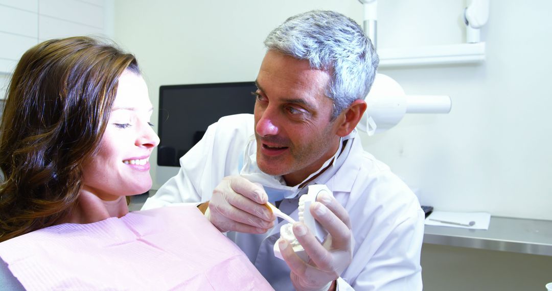 Smiling Patient Receiving Dental Checkup from Experienced Dentist - Free Images, Stock Photos and Pictures on Pikwizard.com