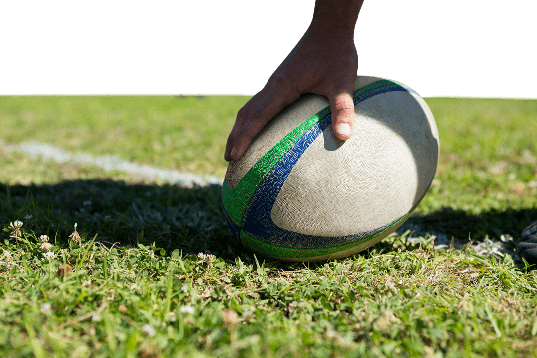 Transparent Rugby Ball Hold by Player on Grass Field