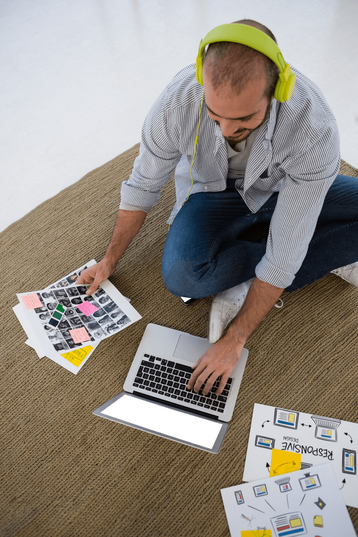 Creative Designer Working with Transparent Images on Laptop