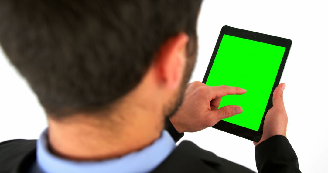 Businessman Using Digital Tablet with Green Screen - Free Images, Stock Photos and Pictures on Pikwizard.com