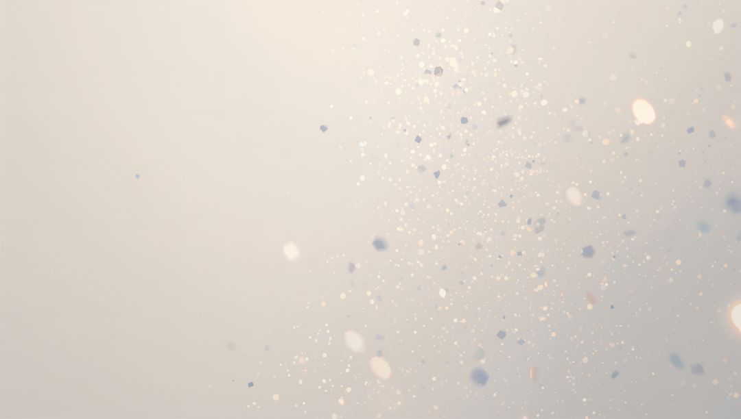 Ethereal shimmering particles drifting across soft gradient with bokeh and lens flare