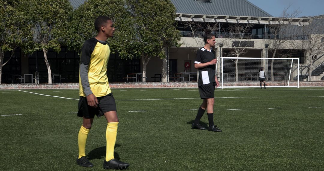 Youth Soccer Game in Action on Sunny Day with Lush Green Background
