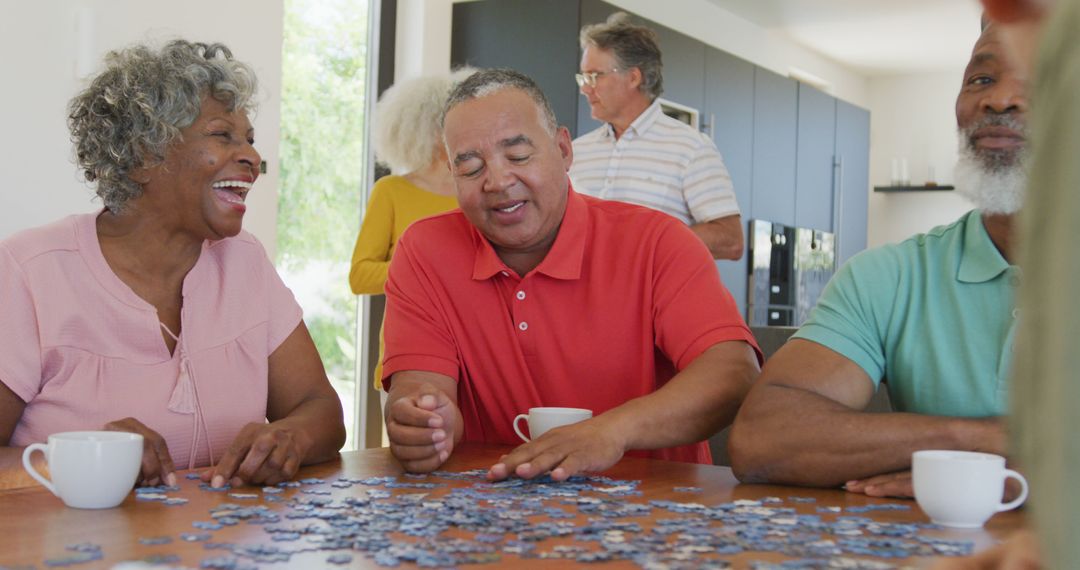 Cheerful Seniors Solving Puzzle Together in Retirement Home - Free Images, Stock Photos and Pictures on Pikwizard.com