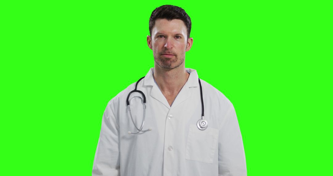 Confident Doctor with Stethoscope Isolated on Green Background - Free Images, Stock Photos and Pictures on Pikwizard.com