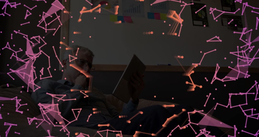 Man Using Tablet in Office Lounge with Digital Network Graphics