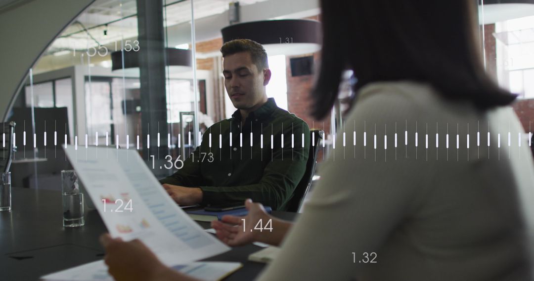 Analyzing Business Data with Diverse Team in Modern Office