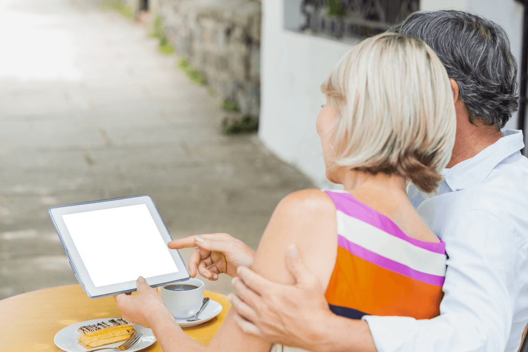 Couple Reflecting Perusing Digital Tablet in Urban Setting with Coffee