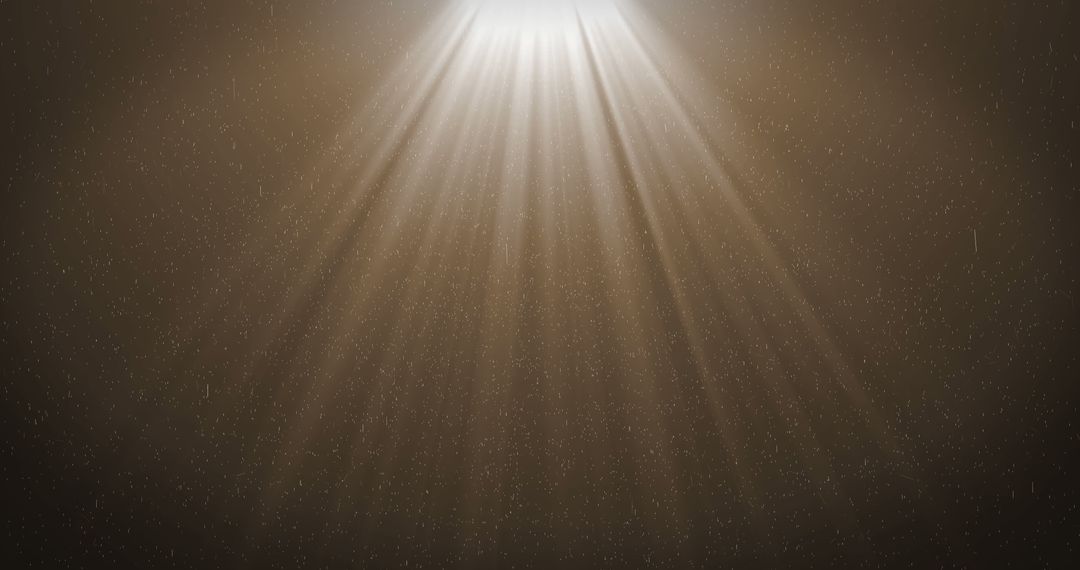 Radiant Light Rays and Falling Particles Over Dark Backdrop