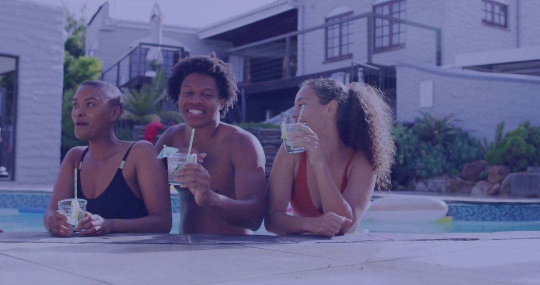 Group of Friends Relaxing by Backyard Poolside with Refreshing Drinks