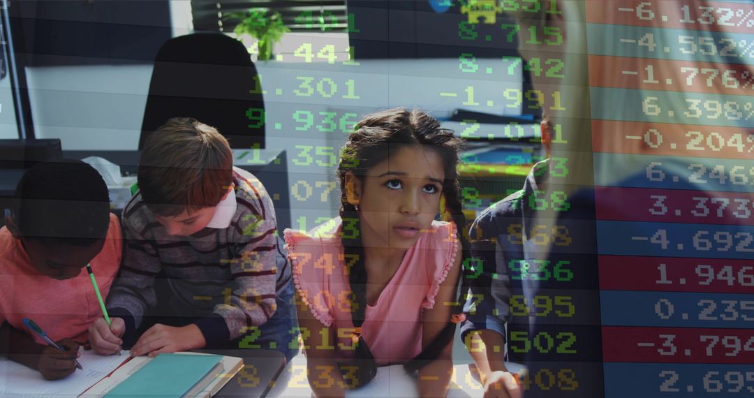 Young students collaborating and writing in classroom with stock market data overlay