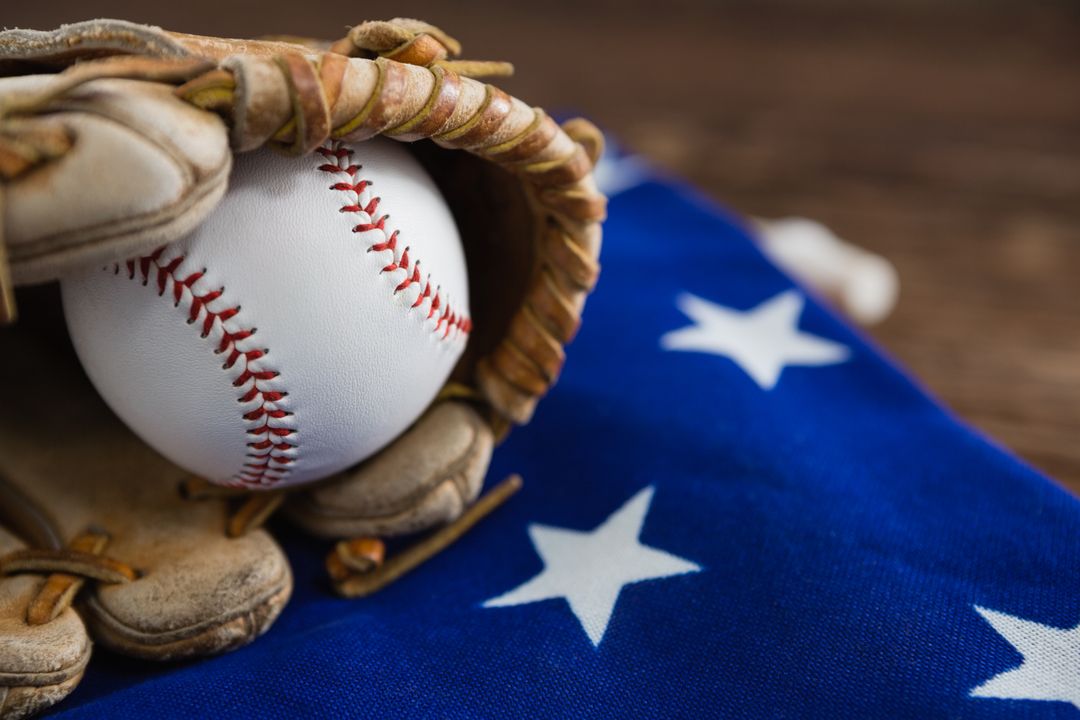 Close-up of Baseball and Glove on American Flag - Free Images, Stock Photos and Pictures on Pikwizard.com