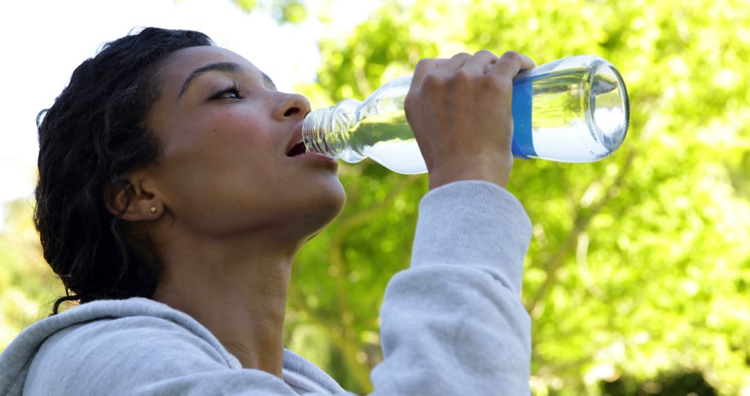 Active Woman Drinking Water Outdoors - Free Images, Stock Photos and Pictures on Pikwizard.com