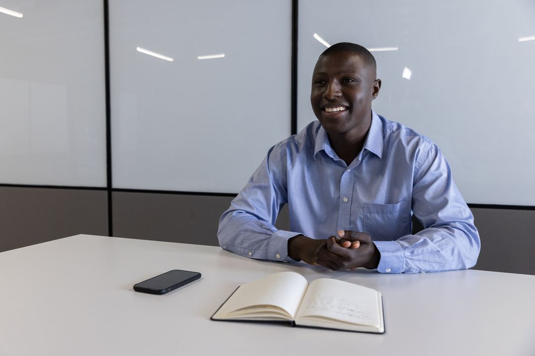 Professional Man Smiling in a Modern Office Setting