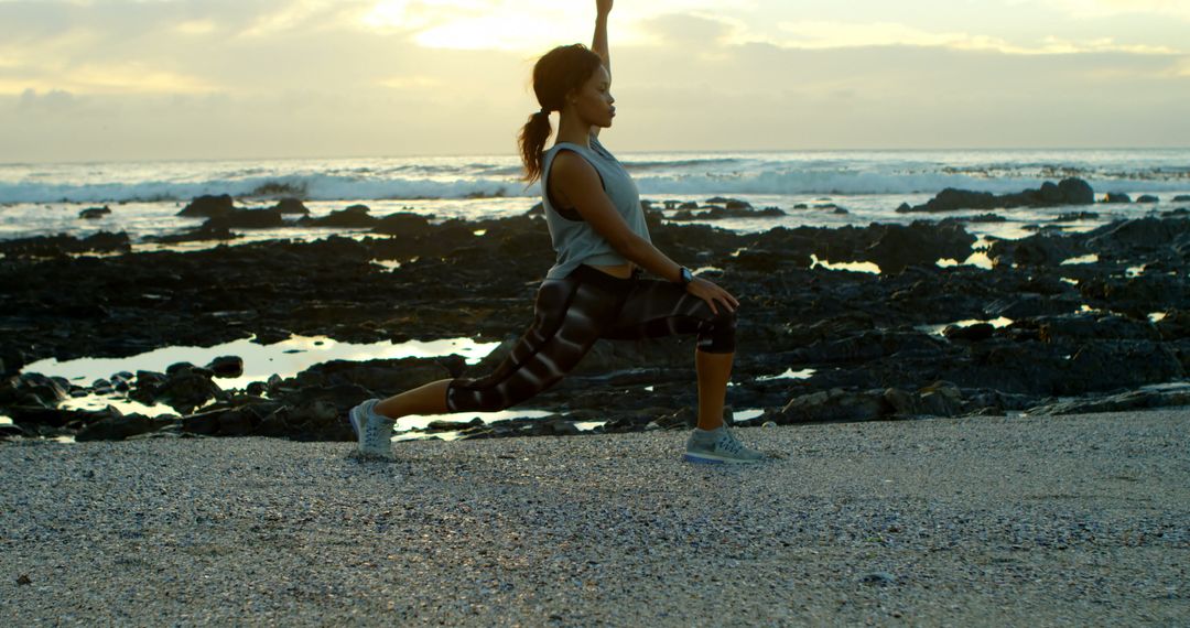 Woman Practicing Yoga Poses on Rocky Beach at Sunset - Free Images, Stock Photos and Pictures on Pikwizard.com