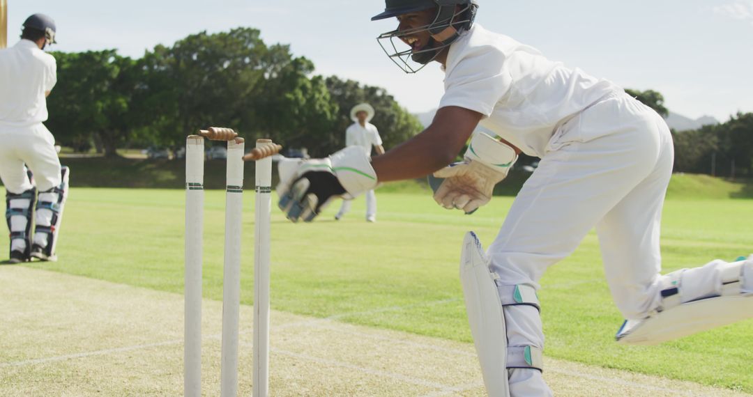 Cricketer Running Between Wickets on Sunny Day - Free Images, Stock Photos and Pictures on Pikwizard.com