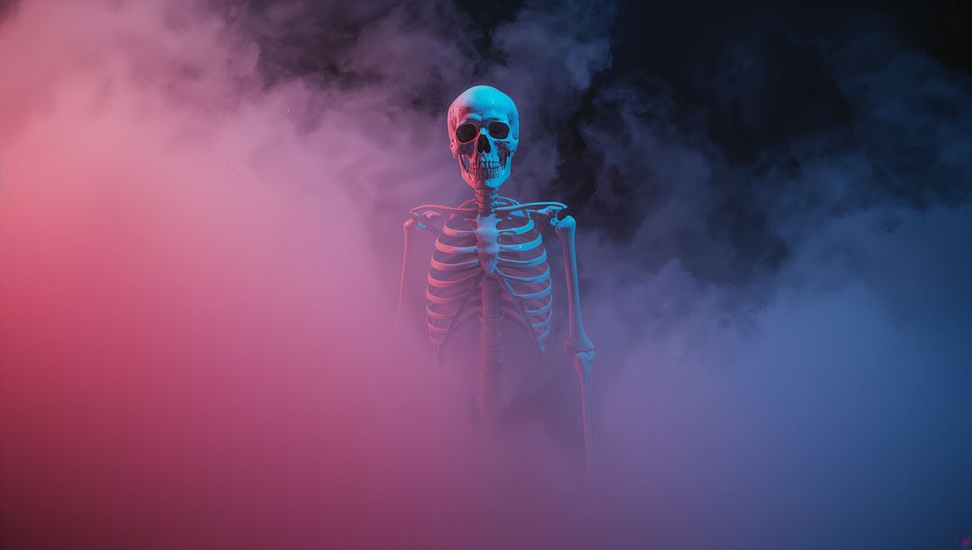 Skeleton Illuminated by Colorful Lights and Fog in Mysterious Ambiance