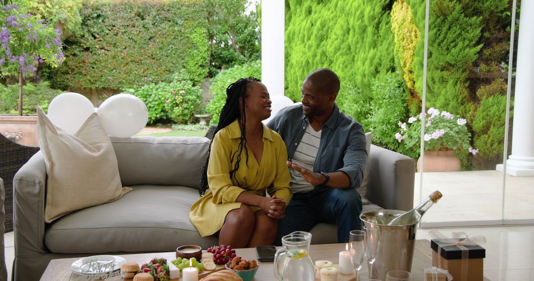 Couple Enjoy Relaxed Conversation on Scenic Patio