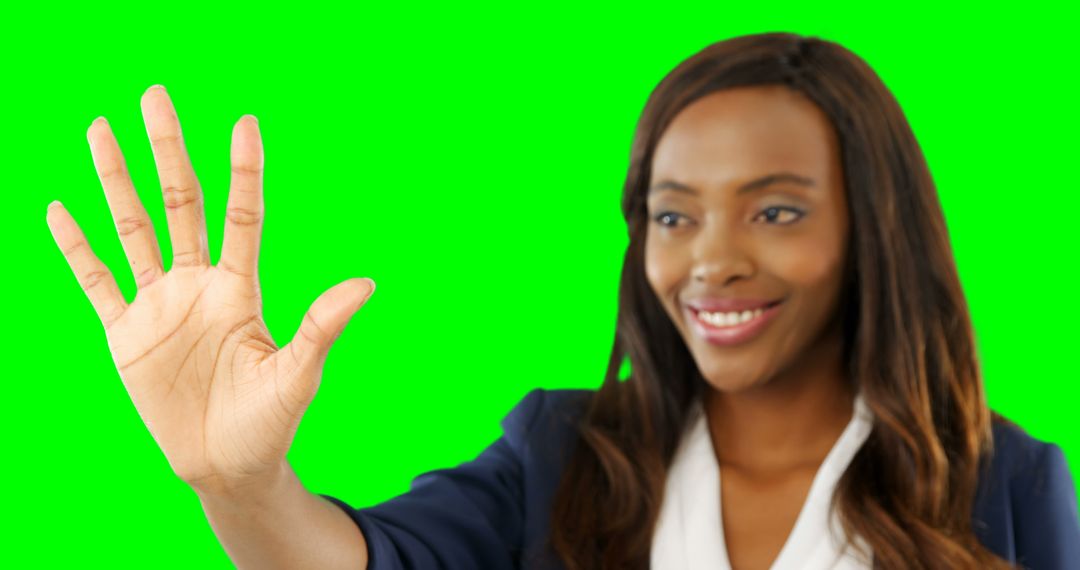 Smiling Woman Waving Hand Against Green Screen - Free Images, Stock Photos and Pictures on Pikwizard.com