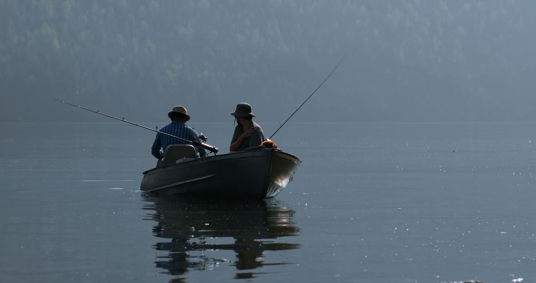 Two Friends Fishing on Mountain Lake at Sunrise - Free Images, Stock Photos and Pictures on Pikwizard.com