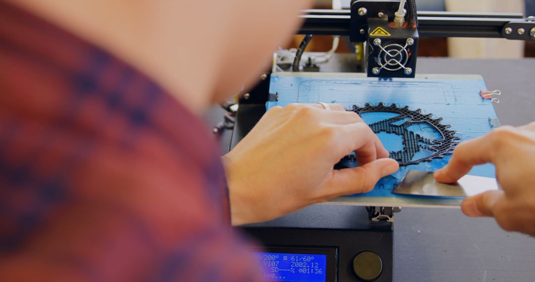 Close-Up of Person Operating 3D Printer - Free Images, Stock Photos and Pictures on Pikwizard.com