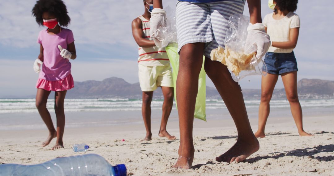 Group of People Collecting Plastic Litter on Beach - Free Images, Stock Photos and Pictures on Pikwizard.com