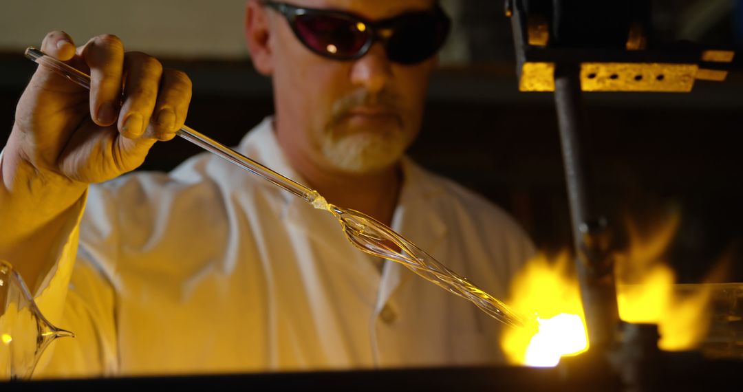 Glassblower Shaping Molten Glass Under Intense Flame - Free Images, Stock Photos and Pictures on Pikwizard.com