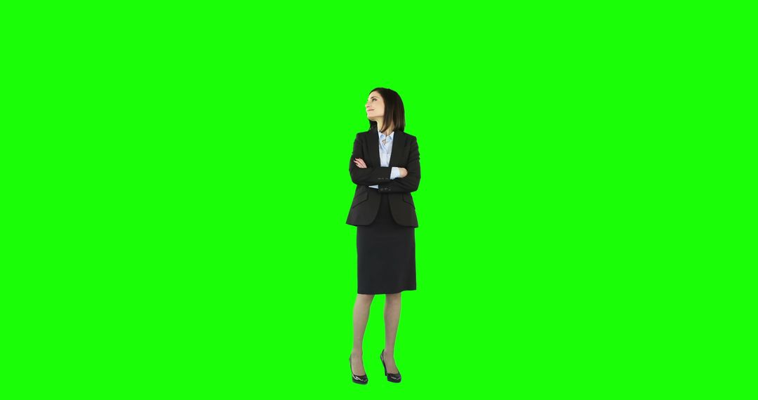 Confident Businesswoman in Suit on Green Background Smiling - Free Images, Stock Photos and Pictures on Pikwizard.com