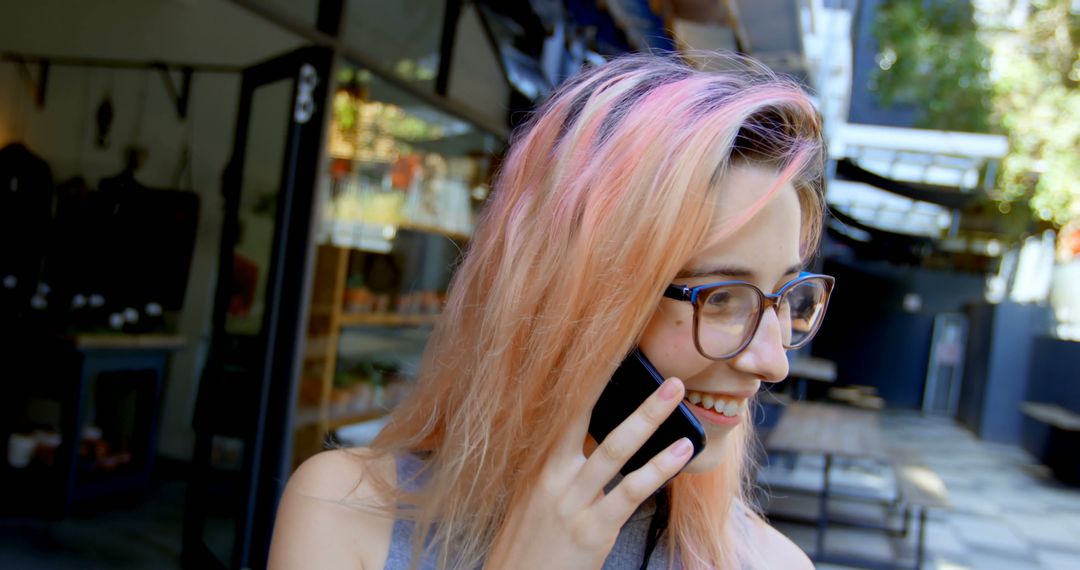 Young Woman Talking on Phone with Colorful Hair Outdoors - Free Images, Stock Photos and Pictures on Pikwizard.com