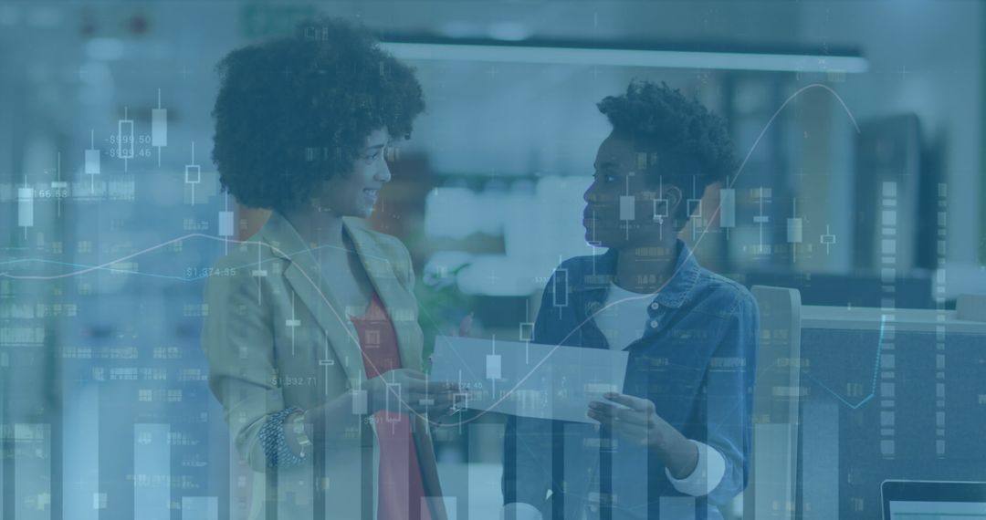 Diverse Female Coworkers Discussing Business Strategy