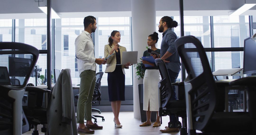 Diverse Team Engaged in Office Strategy Meeting