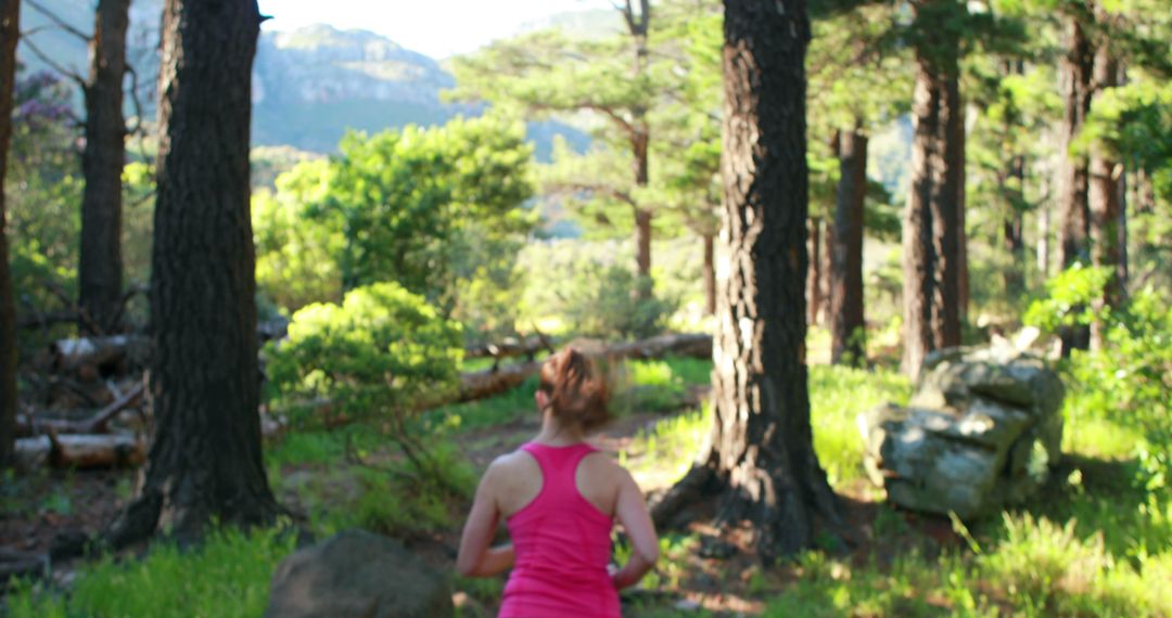 Young woman running in forest on sunny day - Free Images, Stock Photos and Pictures on Pikwizard.com