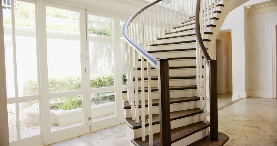Luxurious Spiral Staircase in Sunlit Modern Home
