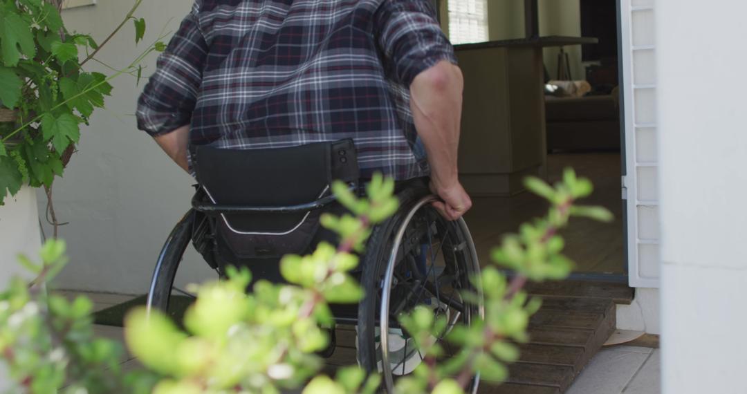 Man in Wheelchair Entering Home, Ensuring Accessibility - Free Images, Stock Photos and Pictures on Pikwizard.com