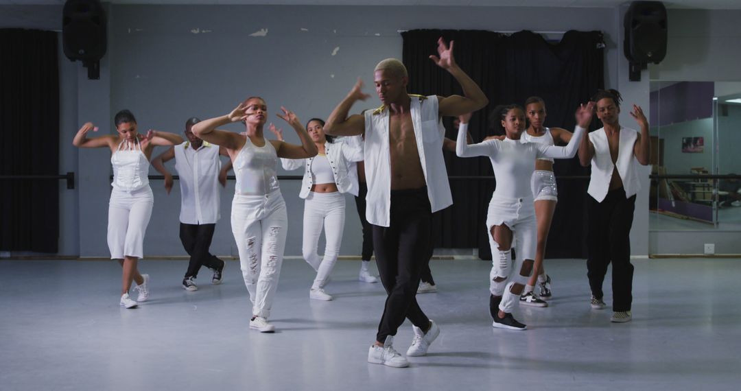 Energetic Dance Rehearsal with Diverse Group in Studio Setting