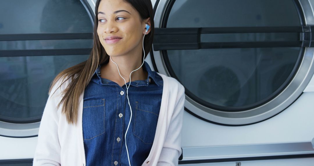 Young Woman Listening to Music at Laundromat Leisure Time - Free Images, Stock Photos and Pictures on Pikwizard.com