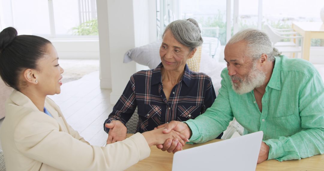 Senior Couple Engaging with Advisor at Home