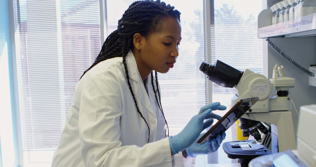 Female Scientist Using Tablet in Modern Laboratory - Free Images, Stock Photos and Pictures on Pikwizard.com