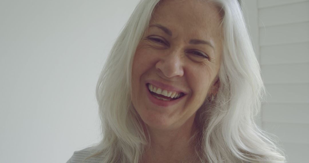 Happy Senior Woman with White Hair Smiling - Free Images, Stock Photos and Pictures on Pikwizard.com