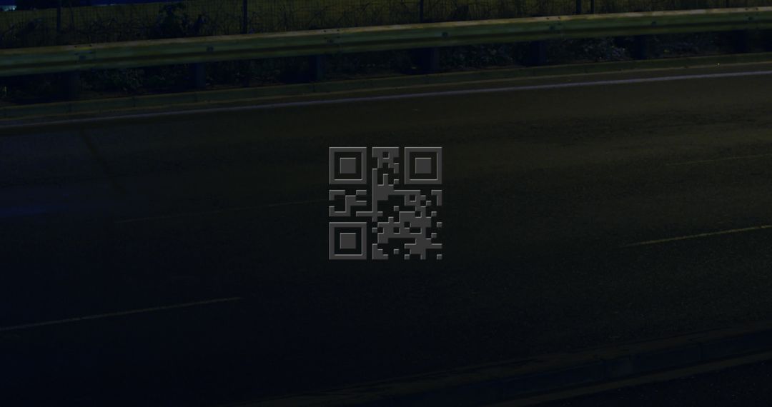 Illuminated Pink QR Code on Dark Urban Street