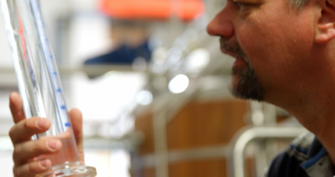 Scientist Examining Laboratory Equipment - Free Images, Stock Photos and Pictures on Pikwizard.com