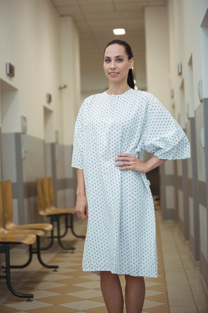 Female Patient Standing in Hospital Corridor - Free Images, Stock Photos and Pictures on Pikwizard.com