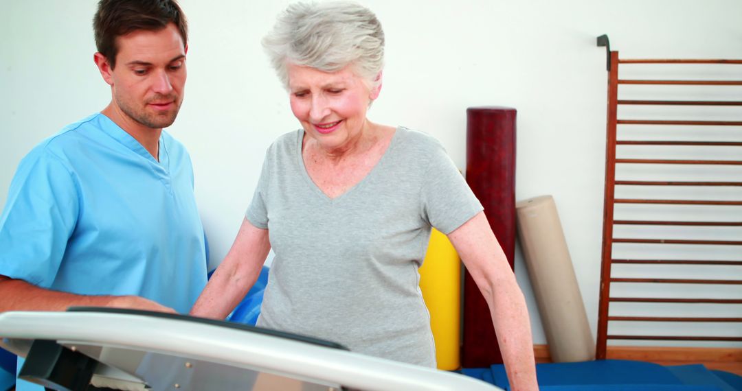 Physiotherapist Assisting Senior Woman on Treadmill in Rehabilitation Center - Free Images, Stock Photos and Pictures on Pikwizard.com